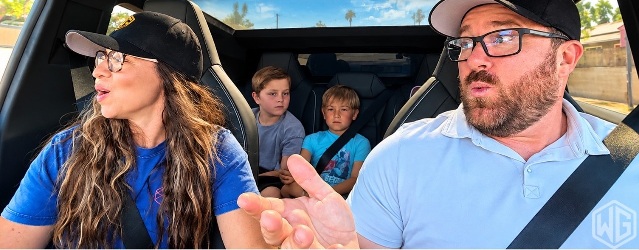 Andy, his wife, and their two boys talking in the Cybertruck